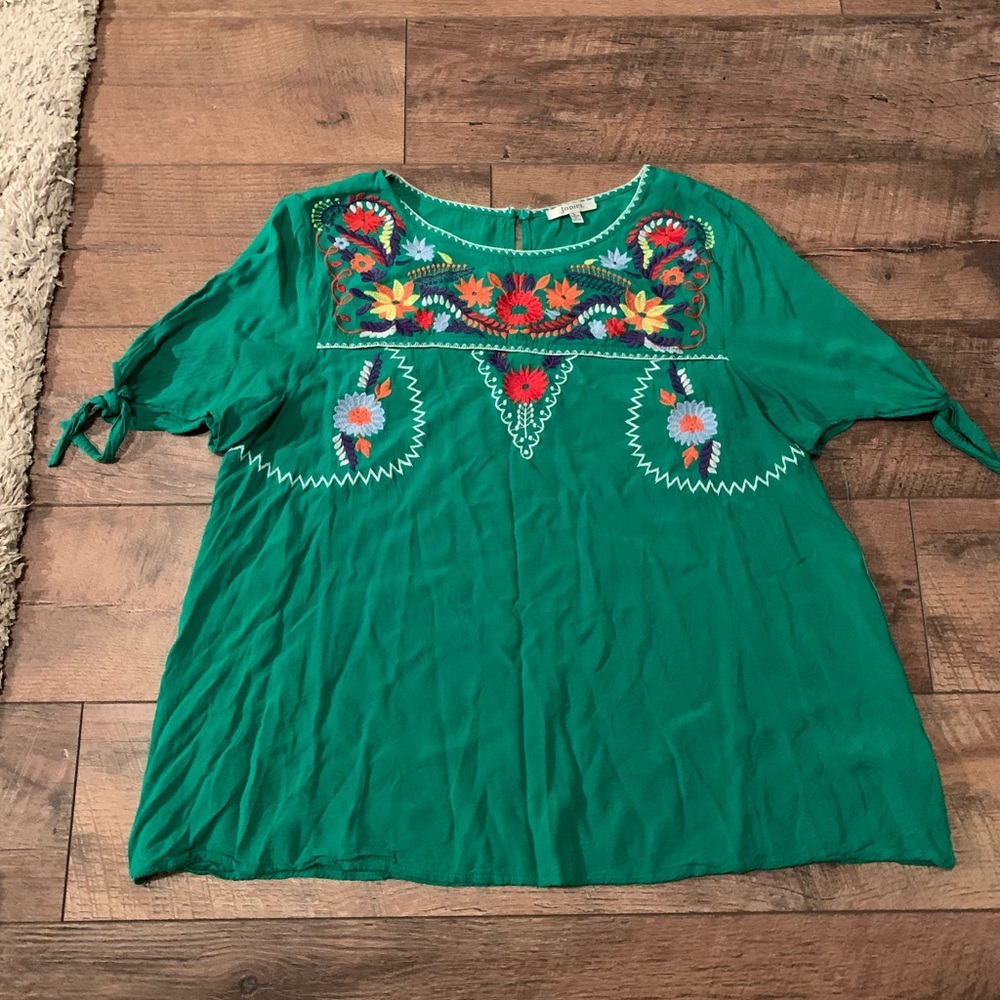Size large blouse but runs small.